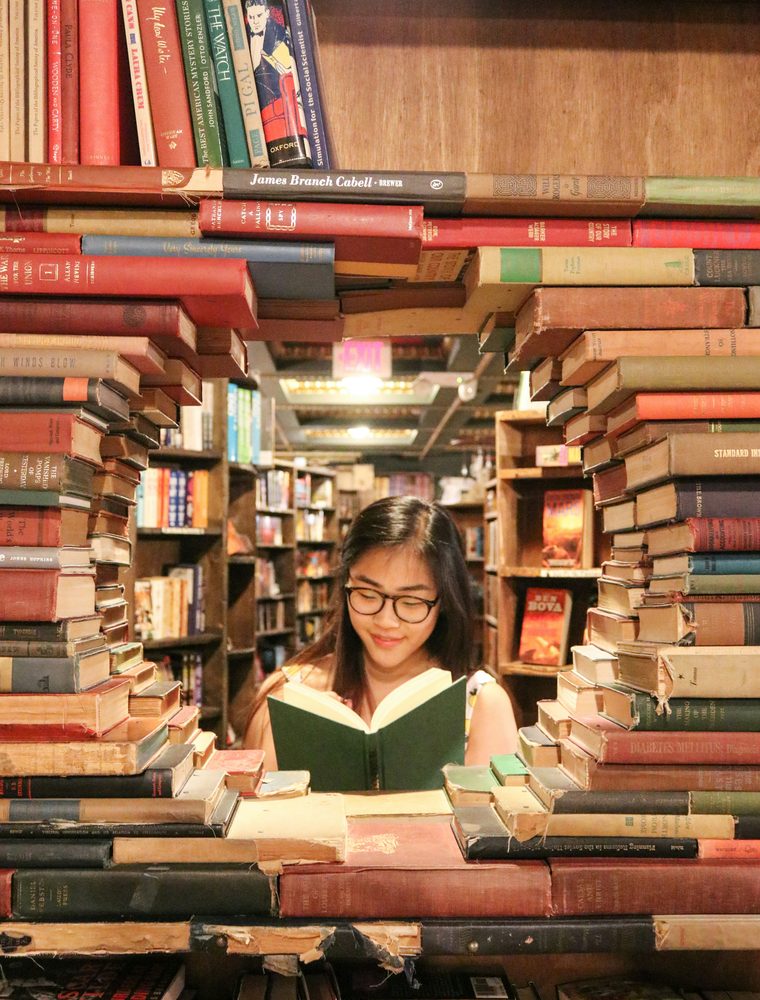 Student reading in a bookshop